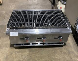 Cookline 60" stainless steel gas char broiler on legs, radiant design, three control knobs, used condition.