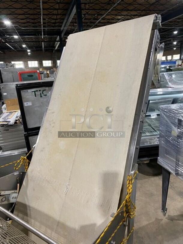 Moline electric reversible dough sheeter/molder, free-standing, working condition, industrial warehouse setting.