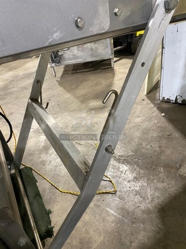 Moline commercial electric free-standing reversible dough sheeter in good condition, sturdy metal frame, shown in working area.