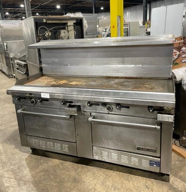 Garland H280 Series stainless steel griddle range/double oven combo, Model H289RC-72GTH, with splash guards and overhead shelf on casters.