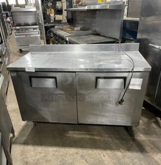 True TWT-60 stainless steel 2-door worktop refrigerator. Energy Star certified, with backsplash, poly-coated rack, on casters.