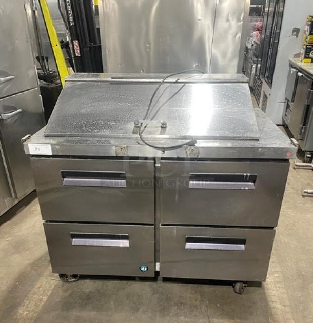 Hoshizaki stainless steel 4-drawer refrigerated prep table, Bain Marie style, on casters, with visible top openings for storage.