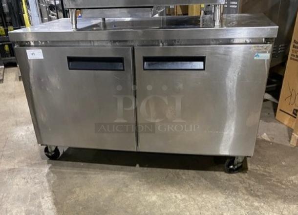 Commercial stainless steel 2-door refrigerated lowboy worktop cooler with poly-coated wired rack, on casters.