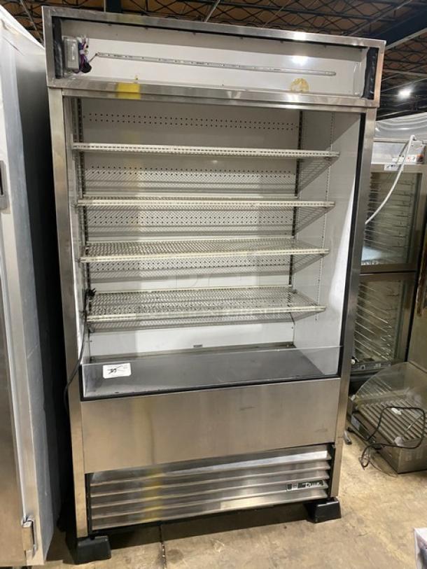 True Commercial Stainless Steel Multi-Tier Refrigerated Display Case, Model TAC-48-LD, adjustable racks, on legs, good condition.