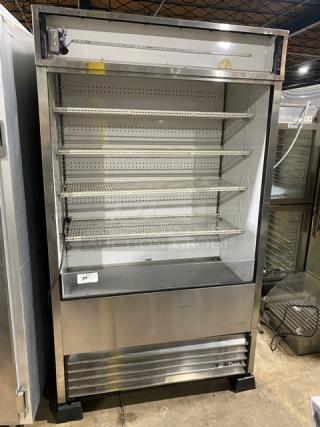 True Commercial Stainless Steel Multi-Tier Refrigerated Display Case, Model TAC-48-LD, adjustable racks, on legs, good condition.