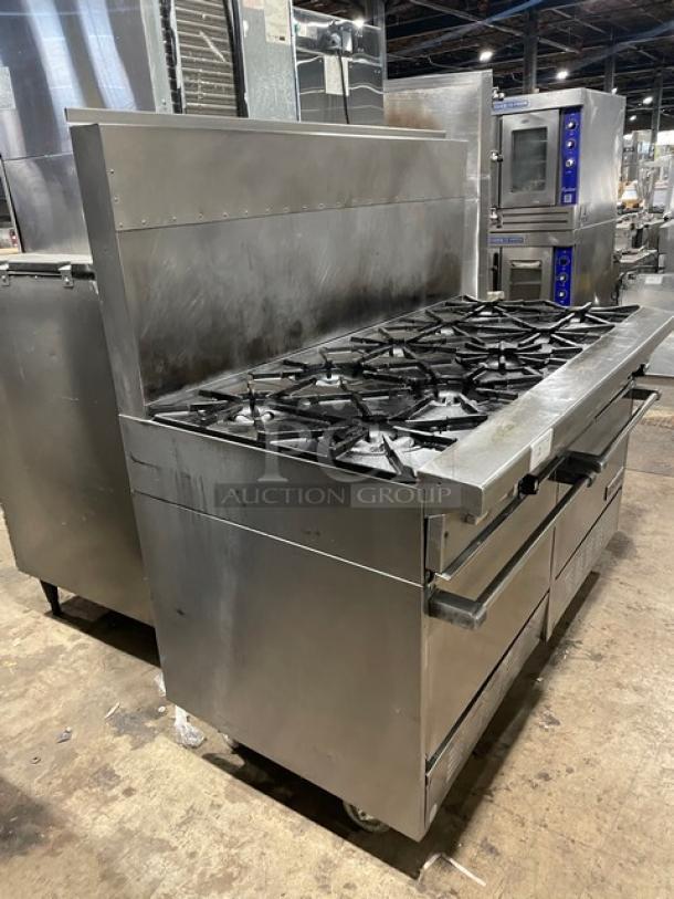 Garland Model H284 stainless steel 10-burner range with double oven, backsplash, and wired oven rack on casters.