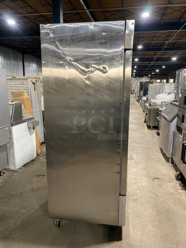 Sir Lawrence SLFRZ2D stainless steel reach-in freezer, with poly-coated racks, on casters, 115V 1 Phase, excellent condition.