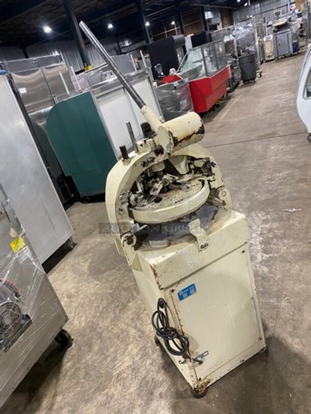 Benier commercial dough divider/rounder/depositor, floor style, heavy-duty, 220V, visible wear, sturdy build.