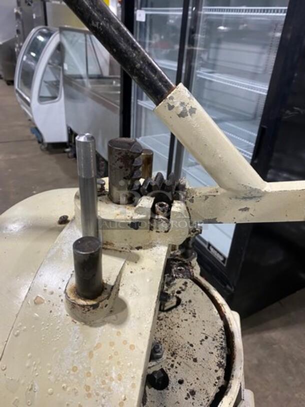 Benier commercial dough divider/rounder; heavy duty, floor style, 220V. Used condition with visible wear and rust.