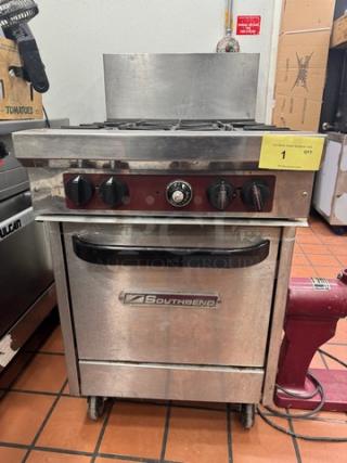SOUTHBEND X424E Commercial NG 4-burner range on casters, featuring control knobs, oven below, Southbend logo on door.