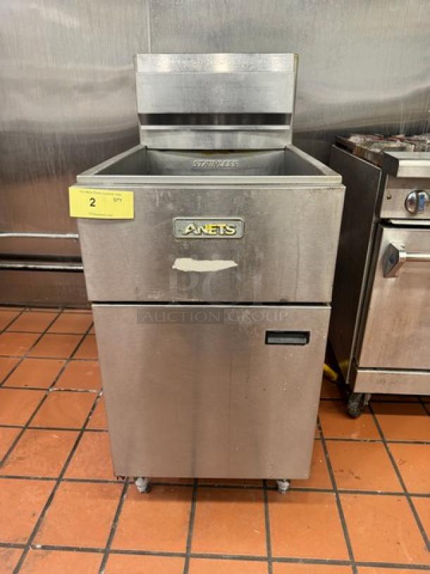 ANETS SLG100 Commercial NG Fryer, stainless steel, front label, used condition, standing on tile floor.