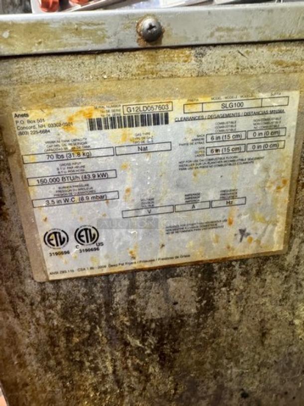 ANETS SLG100 Commercial NG Fryer with baskets; model label indicates 150,000 BTU, holds 70 lbs; used condition.