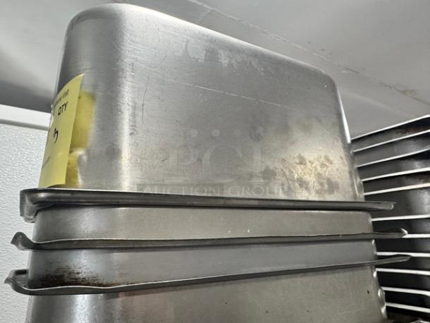 1/3 Full Size Stainless Steel Food Pan BIDX3, used, minor surface wear, stackable design, auction lot tag visible.