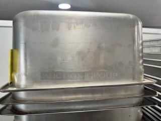 1/3 full size stainless steel food pan, model BIDX3, used condition with minor surface marks, stackable design.
