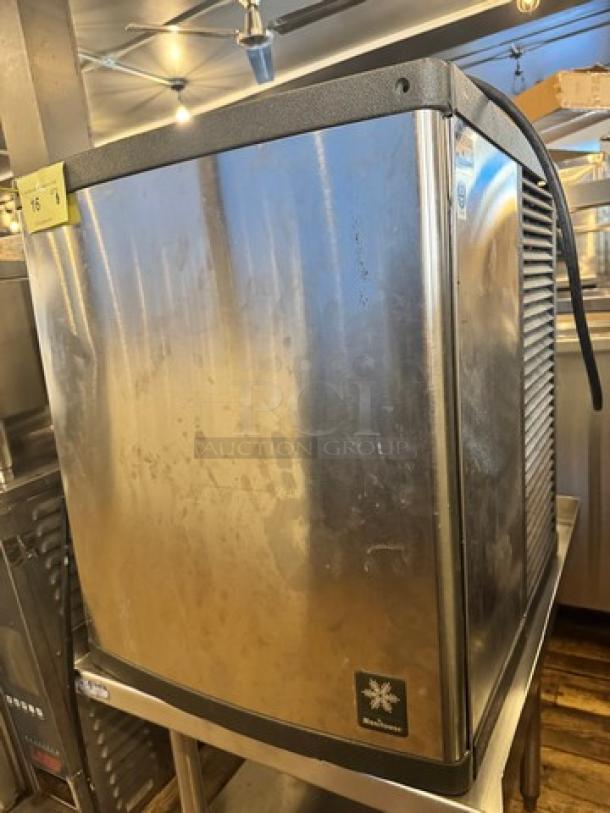 MANITOWOC QY0424A 115V ice maker in stainless steel, used condition, visible wear marks, measures approx. 26"x 27"x 21".