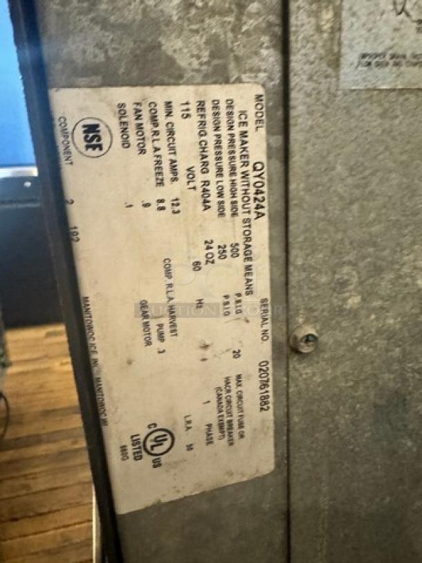MANITOWOC QY0424A ice maker, 115V, model label visible, listing specs, used condition.