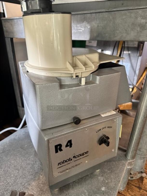 robot-coupe R4 commercial food processor, 220V, metallic body, dual-speed control, used condition, visible brand marking.