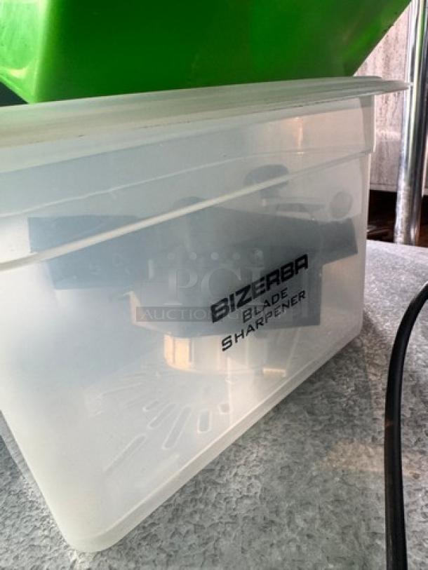 Bizerba L-23 Commercial Automatic Meat Slicer, 120V, includes blade sharpener in a branded plastic box.