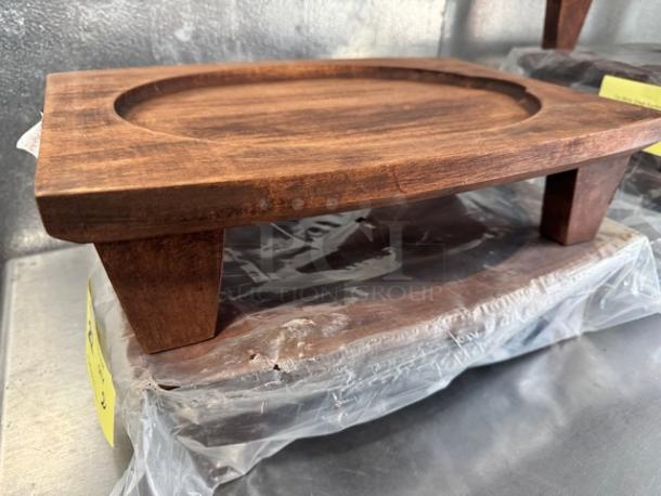 14" Rubberwood display stand for hot skillets, new condition, rectangular with rounded edges, sturdy legs.