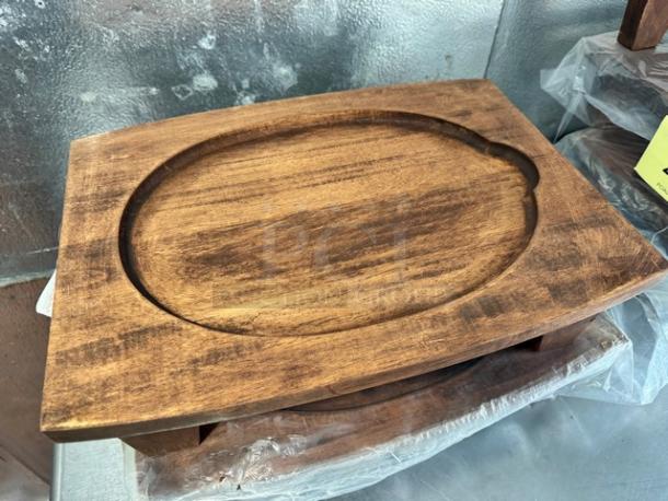 14" rubberwood display stand for hot skillets and dishes, oval design, new condition, stacked with plastic wrap, brand BIDX2.