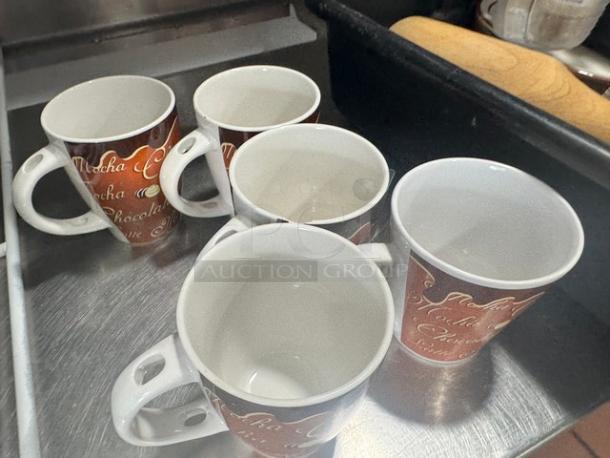 Lot of 5 cappuccino mugs, brown with white script, gently used condition.