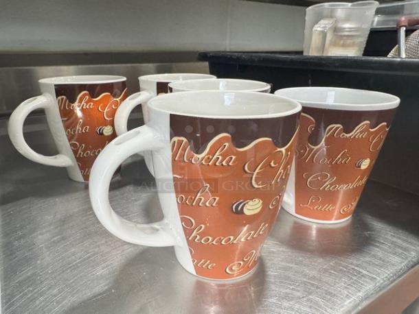 Lot of 5 cappuccino mugs featuring mocha and chocolate text design, in good condition, white interior, and sturdy handles.