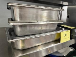 Stainless steel stackable pans with lids, model BIDX3, showing minor wear. Auction tag indicates lot 30.
