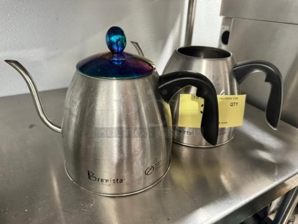 Lot of 2 Brewista gooseneck kettles, stainless steel, one with lid, used condition, visible brand logo.