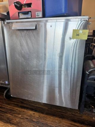 Delfield 406-CA Undercounter Refrigerator in stainless steel. Model 406-CA, 115V. Visible wear, with label indicating "Qty 36".