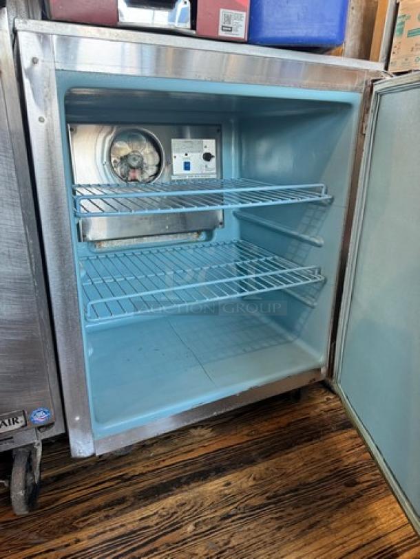 Delfield 406-CA Undercounter Refrigerator, 115V, open door view showing interior racks, lightly used condition.