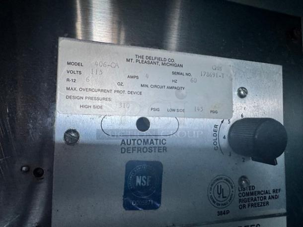 Delfield 406-CA undercounter refrigerator with 115V. Features automatic defroster and coolness adjust knob. NSF certified.