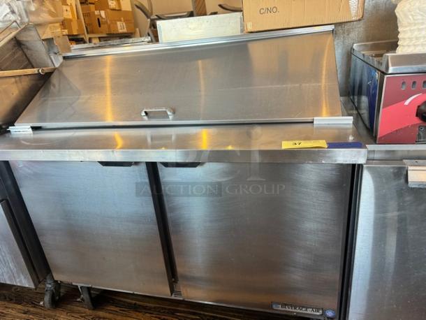 Beverage-Air SPE48-18M 48" prep-table, stainless steel, dual doors, on casters, visible brand label, 115V power.