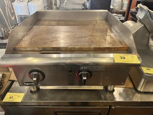Superior GGM-24 24" natural gas griddle, stainless steel, dual control knobs, used condition, auction tag visible.