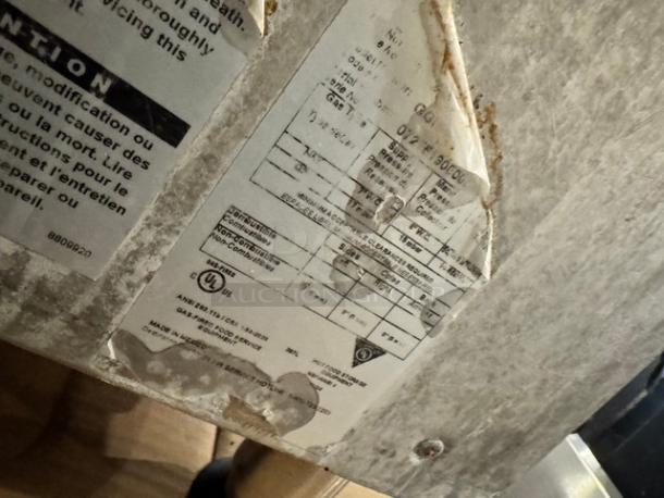 Superior GGM-24 24" Natural Gas Griddle label, showing specifications and compliance markings. Visible wear on the label.