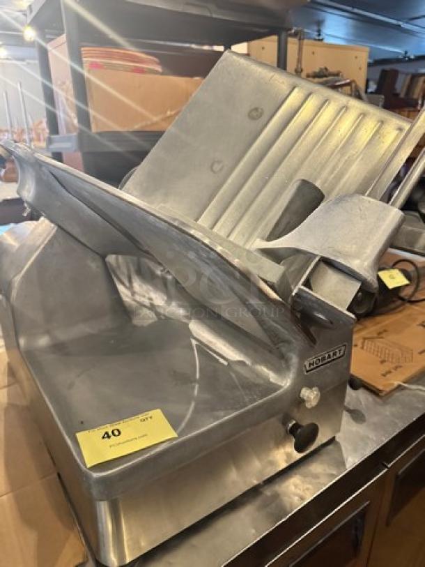 Hobart 1712 Commercial Meat Slicer, 115V, stainless steel, visible wear, Hobart logo and model labeling, auction lot 40.