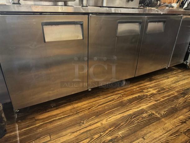 TRUE TWT-93 3 Door Worktop Refrigerator on casters, stainless steel, used condition, ideal for commercial kitchens.