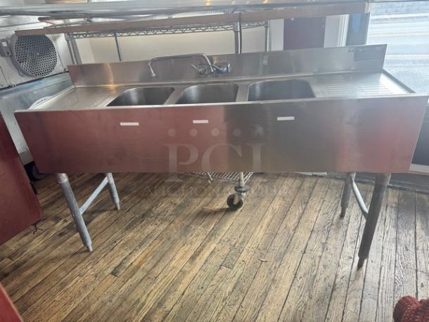 EAGLE 3-compartment underbar sink, stainless steel, with faucet and two drainboards. Clean condition, ideal for commercial use.