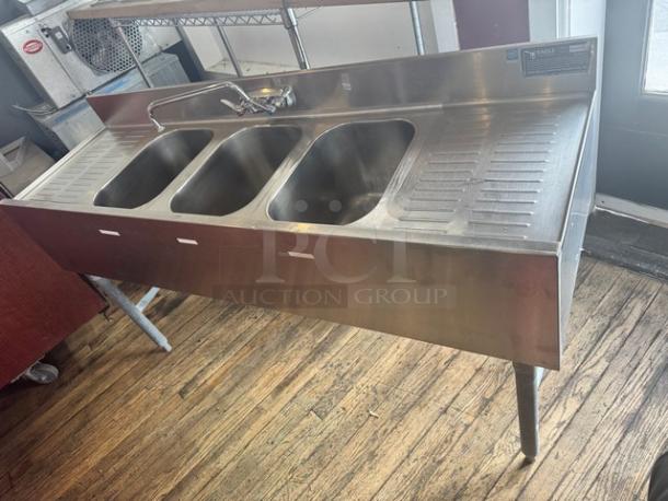 EAGLE stainless steel underbar sink with 3 compartments, faucet, and 2 drainboards. Features durable construction and excellent condition.