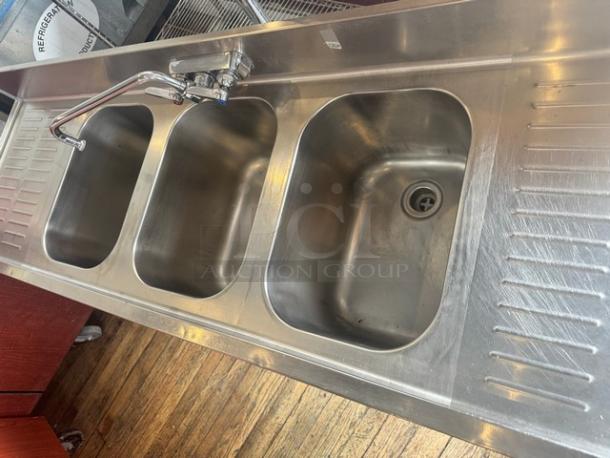 EAGLE stainless steel 3-compartment underbar sink with faucet, features two drainboards, in good condition.