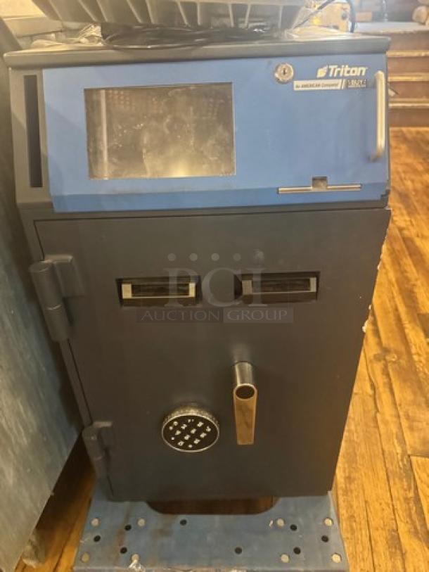 Triton VS8422 smart safe, black and blue, electronic lock, dual slots, brand label visible, mounted on blue base.