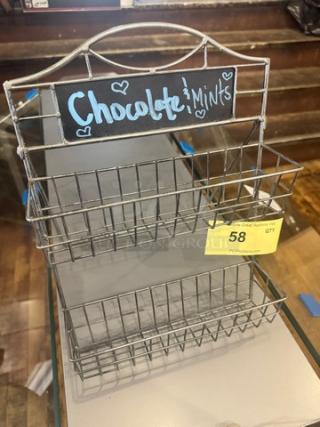Metal countertop display holder with two wire baskets. Chalkboard label reads "Chocolate & Mints." Auction tag number 58 attached.