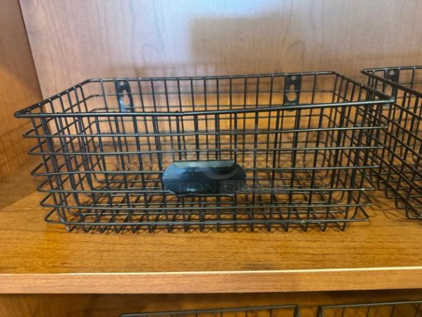 Set of 2 black wire hanging baskets, rectangular design, with mounting holes. Appears in excellent condition.