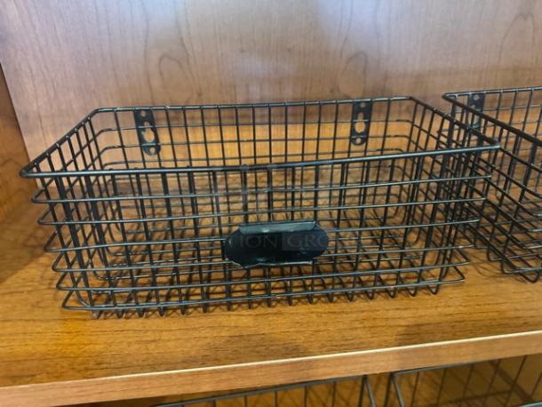 Lot of 2 wire hanging baskets, black metal, wall-mountable, horizontal orientation, in excellent condition.