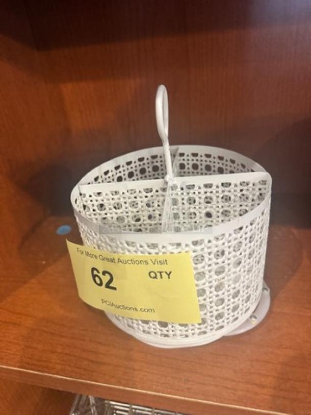 White metal organizer with lattice design, handle, and cylindrical shape. Good condition. Auction tag marked "62."