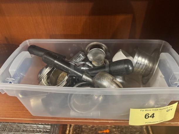 Box of assorted espresso machine accessories, includes portafilters and baskets. Condition: used. Auction lot 64.