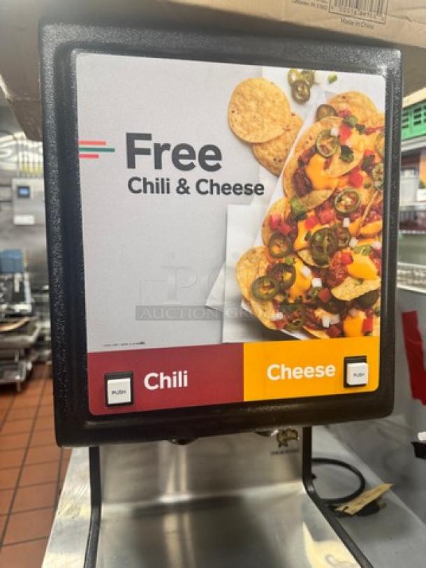 Commercial Star HPOE2 chili-cheese dispenser, 120V. Features dual push controls for chili and cheese. Good condition.