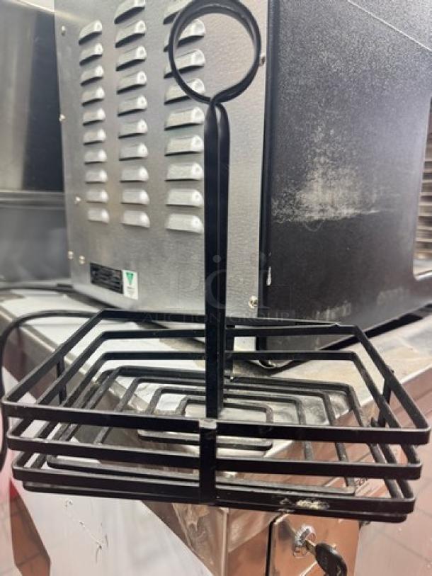 Black metal condiment caddy with card holder, model BIDX6, rectangular design, excellent condition, industrial style.