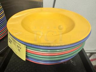 16oz yellow melamine pasta bowl, model BIDX11, in a stack with red, green, and blue bowls. Slight signs of wear.