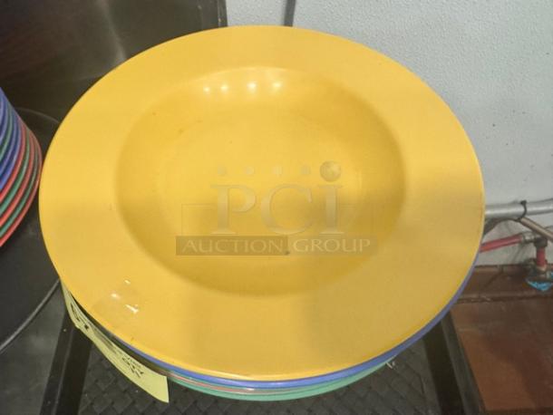 Yellow 16oz round melamine pasta bowl, model BIDX11, in good condition. Stacked with others; vibrant, durable design.