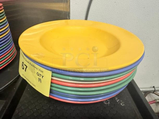 16oz round melamine pasta bowls, assorted colors, BIDX11. Stack of 11, good condition, auction lot tag visible.